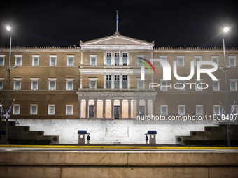 Night view of the Greek Parliament building officially known as The Parliament of the Hellenes or the Hellenic Parliament next to Syntagma S...