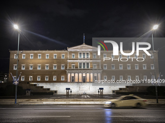 Night view of the Greek Parliament building officially known as The Parliament of the Hellenes or the Hellenic Parliament next to Syntagma S...