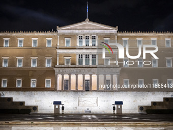 Night view of the Greek Parliament building officially known as The Parliament of the Hellenes or the Hellenic Parliament next to Syntagma S...