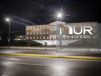 Night view of the Greek Parliament building officially known as The Parliament of the Hellenes or the Hellenic Parliament next to Syntagma S...