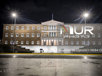 Night view of the Greek Parliament building officially known as The Parliament of the Hellenes or the Hellenic Parliament next to Syntagma S...