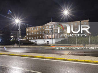 Night view of the Greek Parliament building officially known as The Parliament of the Hellenes or the Hellenic Parliament next to Syntagma S...