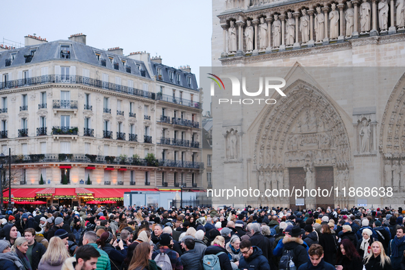 A few days after the reopening of Notre-Dame, people rush to observe or visit the renovated cathedral. 