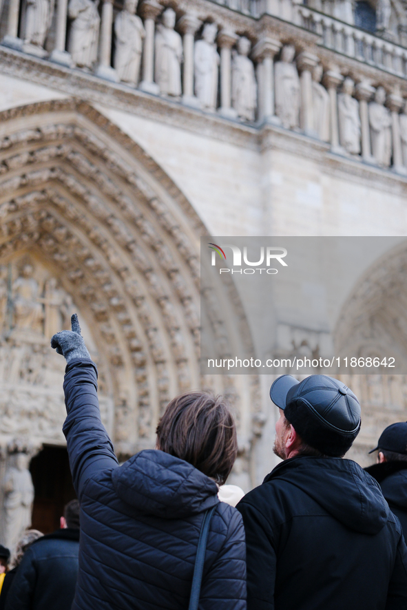 The public admires Notre-Dame Cathedral a few days after its reopening to the public. 