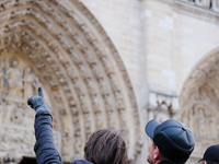 The public admires Notre-Dame Cathedral a few days after its reopening to the public. (