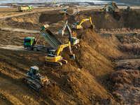 Workers work at the Qingjiangpu section of the second phase of the Huaihe River Waterway project in Huai 'an City, Jiangsu Province, on Dece...