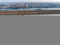 Workers work at the Qingjiangpu section of the second phase of the Huaihe River Waterway project in Huai 'an City, Jiangsu Province, on Dece...