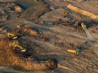 Workers work at the Qingjiangpu section of the second phase of the Huaihe River Waterway project in Huai 'an City, Jiangsu Province, on Dece...