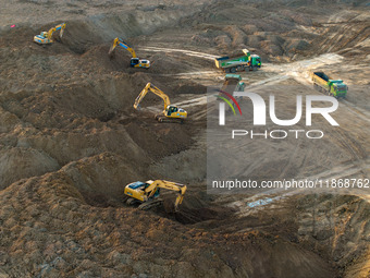 Workers work at the Qingjiangpu section of the second phase of the Huaihe River Waterway project in Huai 'an City, Jiangsu Province, on Dece...