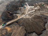 Workers work at the Qingjiangpu section of the second phase of the Huaihe River Waterway project in Huai 'an City, Jiangsu Province, on Dece...