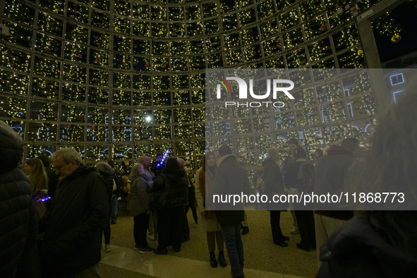 People are inside the Christmas lights at Praca do Comercio in Lisbon, Portugal, on December 14, 2024. The Christmas lights in Lisbon are of...