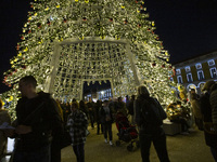 People are inside the Christmas lights at Praca do Comercio in Lisbon, Portugal, on December 14, 2024. The Christmas lights in Lisbon are of...