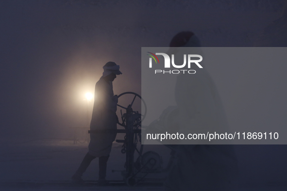 Labourers work at the ''White Mountain'' limestone extraction quarry site near Minya, Egypt, on December 14, 2024. Covered in fine white dus...