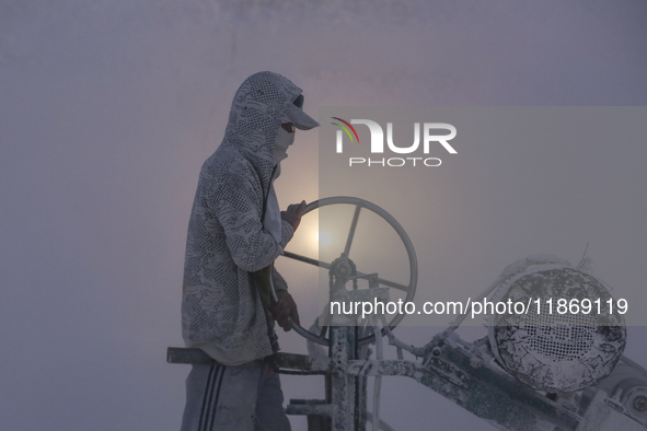 Labourers work at the ''White Mountain'' limestone extraction quarry site near Minya, Egypt, on December 14, 2024. Covered in fine white dus...