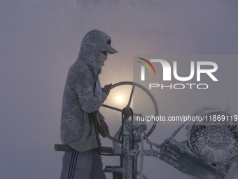 Labourers work at the ''White Mountain'' limestone extraction quarry site near Minya, Egypt, on December 14, 2024. Covered in fine white dus...