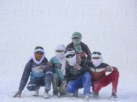 Labourers work at the ''White Mountain'' limestone extraction quarry site near Minya, Egypt, on December 14, 2024. Covered in fine white dus...