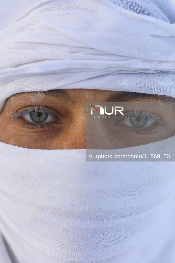 Labourers work at the ''White Mountain'' limestone extraction quarry site near Minya, Egypt, on December 14, 2024. Covered in fine white dus...