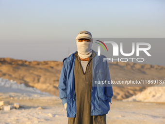 Labourers work at the ''White Mountain'' limestone extraction quarry site near Minya, Egypt, on December 14, 2024. Covered in fine white dus...