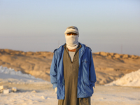 Labourers work at the ''White Mountain'' limestone extraction quarry site near Minya, Egypt, on December 14, 2024. Covered in fine white dus...