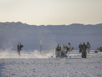 Labourers work at the ''White Mountain'' limestone extraction quarry site near Minya, Egypt, on December 14, 2024. Covered in fine white dus...