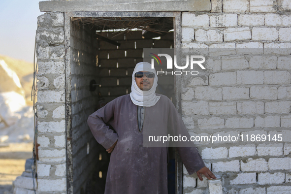 Labourers work at the ''White Mountain'' limestone extraction quarry site near Minya, Egypt, on December 14, 2024. Covered in fine white dus...