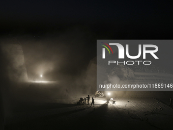 Labourers work at the ''White Mountain'' limestone extraction quarry site near Minya, Egypt, on December 14, 2024. Covered in fine white dus...