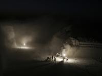 Labourers work at the ''White Mountain'' limestone extraction quarry site near Minya, Egypt, on December 14, 2024. Covered in fine white dus...