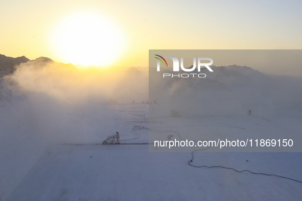 Labourers work at the ''White Mountain'' limestone extraction quarry site near Minya, Egypt, on December 14, 2024. Covered in fine white dus...