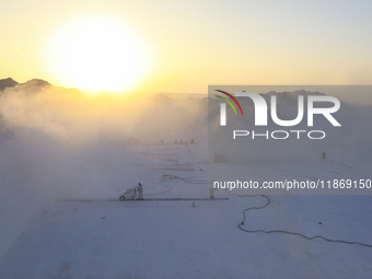 Labourers work at the ''White Mountain'' limestone extraction quarry site near Minya, Egypt, on December 14, 2024. Covered in fine white dus...