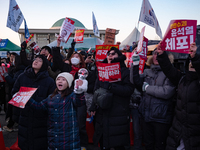 Citizens cheer after the impeachment of President Yoon Suk-yeol is passed in Seoul, South Korea, on December 14, 2024. Approximately 2 milli...