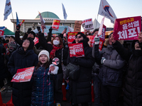 Citizens cheer after the impeachment of President Yoon Suk-yeol is passed in Seoul, South Korea, on December 14, 2024. Approximately 2 milli...