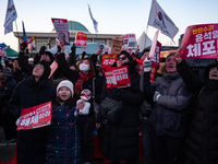 Citizens cheer after the impeachment of President Yoon Suk-yeol is passed in Seoul, South Korea, on December 14, 2024. Approximately 2 milli...