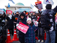 Citizens cheer after the impeachment of President Yoon Suk-yeol is passed in Seoul, South Korea, on December 14, 2024. Approximately 2 milli...