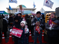 Citizens cheer after the impeachment of President Yoon Suk-yeol is passed in Seoul, South Korea, on December 14, 2024. Approximately 2 milli...