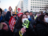 Citizens cheer after the impeachment of President Yoon Suk-yeol is passed in Seoul, South Korea, on December 14, 2024. Approximately 2 milli...