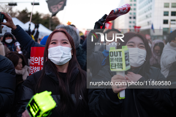 Citizens cheer after the impeachment of President Yoon Suk-yeol is passed in Seoul, South Korea, on December 14, 2024. Approximately 2 milli...