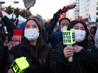 Citizens cheer after the impeachment of President Yoon Suk-yeol is passed in Seoul, South Korea, on December 14, 2024. Approximately 2 milli...