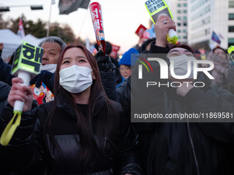 Citizens cheer after the impeachment of President Yoon Suk-yeol is passed in Seoul, South Korea, on December 14, 2024. Approximately 2 milli...