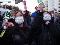 Citizens cheer after the impeachment of President Yoon Suk-yeol is passed in Seoul, South Korea, on December 14, 2024. Approximately 2 milli...