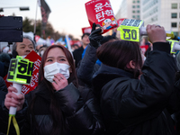 Citizens cheer after the impeachment of President Yoon Suk-yeol is passed in Seoul, South Korea, on December 14, 2024. Approximately 2 milli...