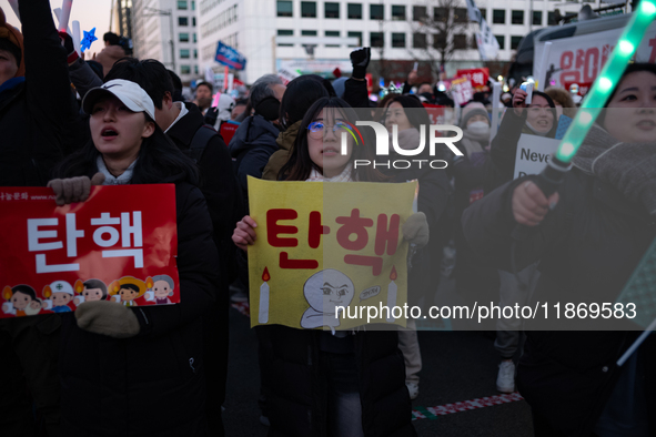 Citizens cheer after the impeachment of President Yoon Suk-yeol is passed in Seoul, South Korea, on December 14, 2024. Approximately 2 milli...