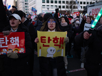 Citizens cheer after the impeachment of President Yoon Suk-yeol is passed in Seoul, South Korea, on December 14, 2024. Approximately 2 milli...