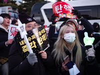 Citizens cheer after the impeachment of President Yoon Suk-yeol is passed in Seoul, South Korea, on December 14, 2024. Approximately 2 milli...