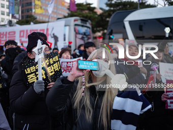 Citizens cheer after the impeachment of President Yoon Suk-yeol is passed in Seoul, South Korea, on December 14, 2024. Approximately 2 milli...