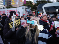 Citizens cheer after the impeachment of President Yoon Suk-yeol is passed in Seoul, South Korea, on December 14, 2024. Approximately 2 milli...