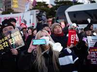 Citizens cheer after the impeachment of President Yoon Suk-yeol is passed in Seoul, South Korea, on December 14, 2024. Approximately 2 milli...