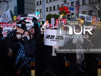 Citizens cheer after the impeachment of President Yoon Suk-yeol is passed in Seoul, South Korea, on December 14, 2024. Approximately 2 milli...