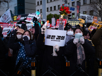 Citizens cheer after the impeachment of President Yoon Suk-yeol is passed in Seoul, South Korea, on December 14, 2024. Approximately 2 milli...