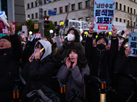 Citizens cheer after the impeachment of President Yoon Suk-yeol is passed in Seoul, South Korea, on December 14, 2024. Approximately 2 milli...