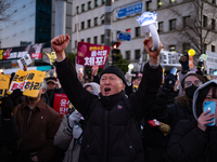 Citizens cheer after the impeachment of President Yoon Suk-yeol is passed in Seoul, South Korea, on December 14, 2024. Approximately 2 milli...